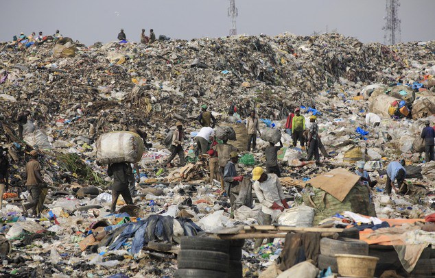 Alt = Scavengers picking plastic wastes from Olusosun landfill in Lagos Nigeria